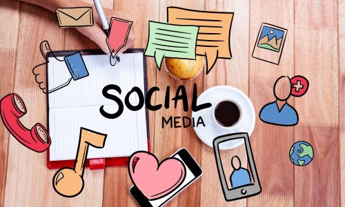 digital composite of hands using notebook with graphics